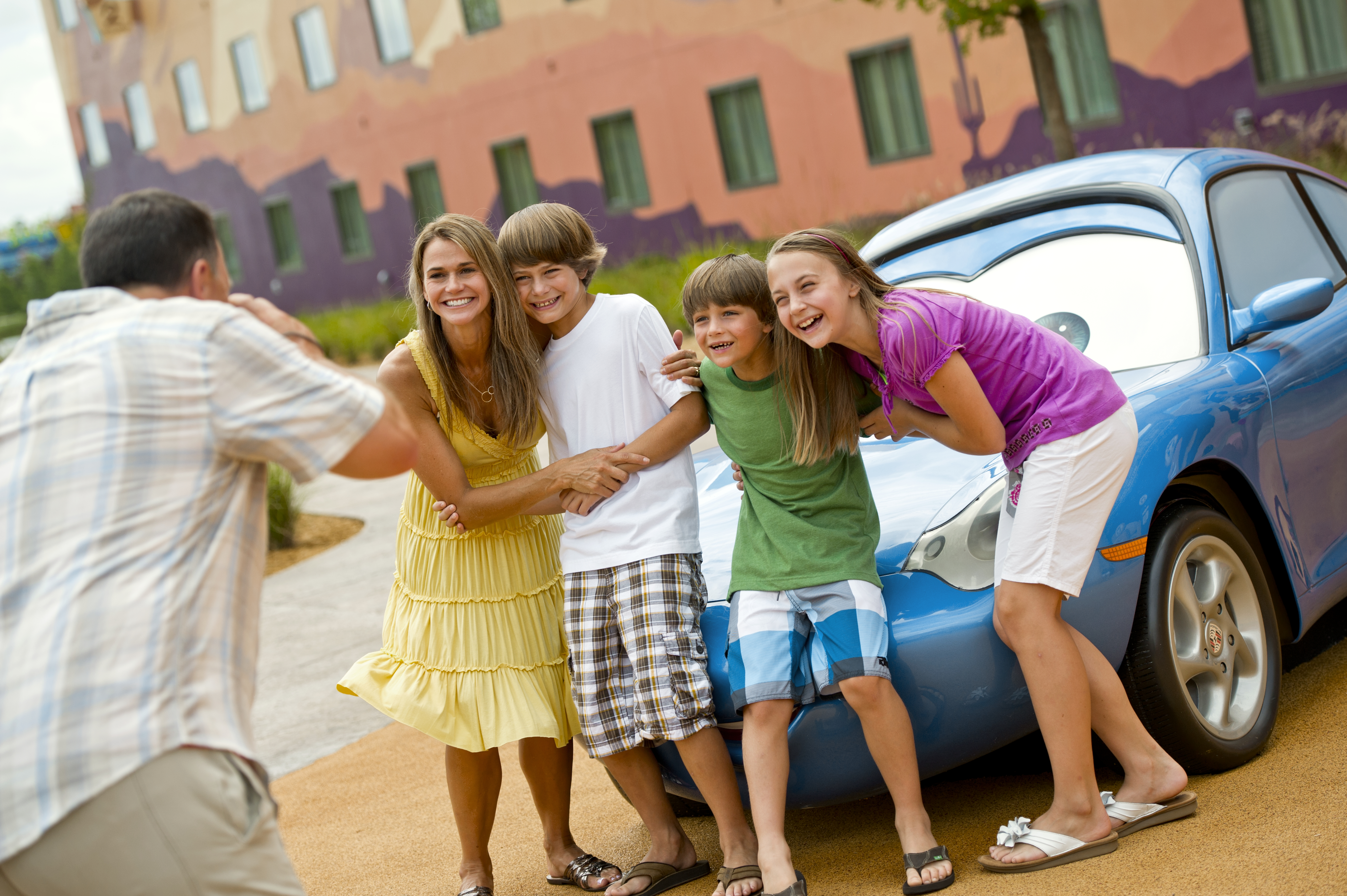 Family in front of Disney Car at Disney World