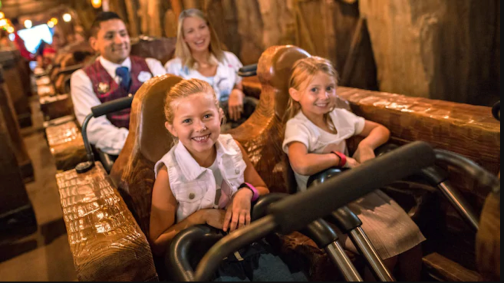 Family riding a ride at Disney World with VIP tour guide