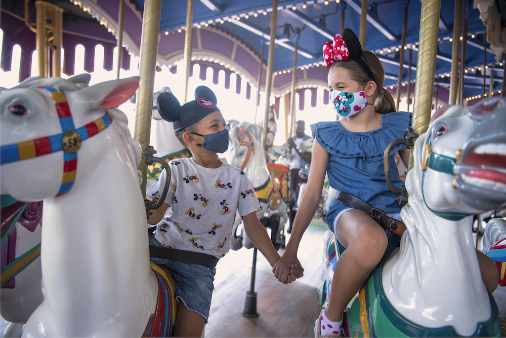 Kids riding carousel at Walt Disney World