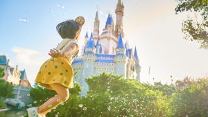 Girl in front of Disney's Cinderella's Castle 