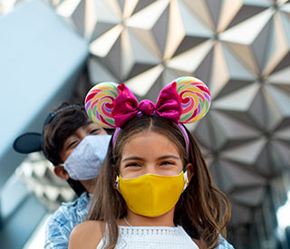 Girl wearing face mask at Disney World